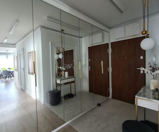 Hallway with mirror-door wardrobe and marble top console table - - Modern Apartment interior design in Warsaw, Poland