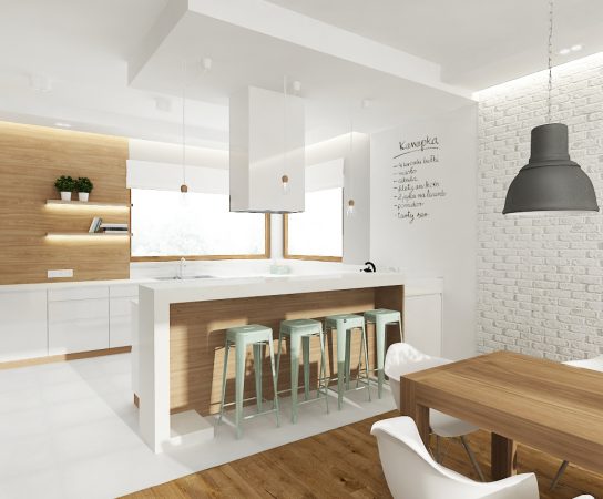 White kitchen interior, light wood paneling, kitchen island, mint bar stools, white brick wall, wooden dining table.