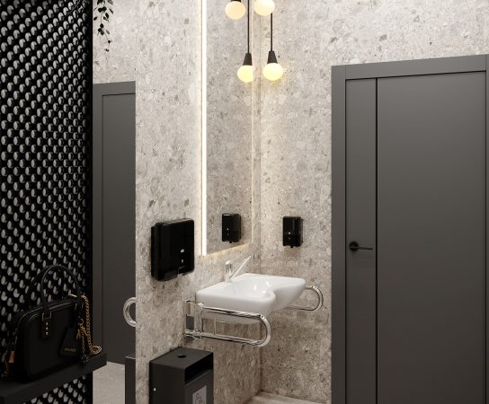 Modern women's restroom or accessible washroom with a white sink, chrome grab bars, black perforated metal ceiling, light terrazzo walls, and black fixtures.