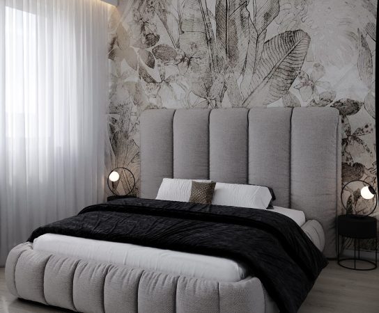 Elegant apartment bedroom design in Łódź with a channeled grey upholstered bed and an oversized tropical floral wallpaper mural.