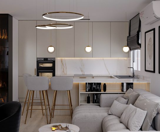 Minimalist kitchen design in a Łódź apartment with beige cabinets, gold-framed bar chairs, and a white marble waterfall countertop.