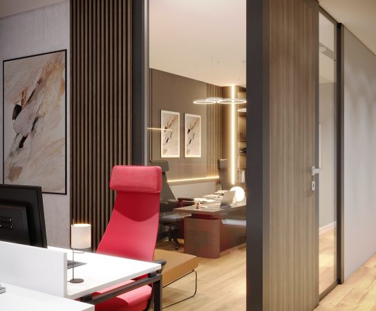 View from outside a private office through a glass wall, showing a bright red high-back executive chair and a view into the inner workspace.